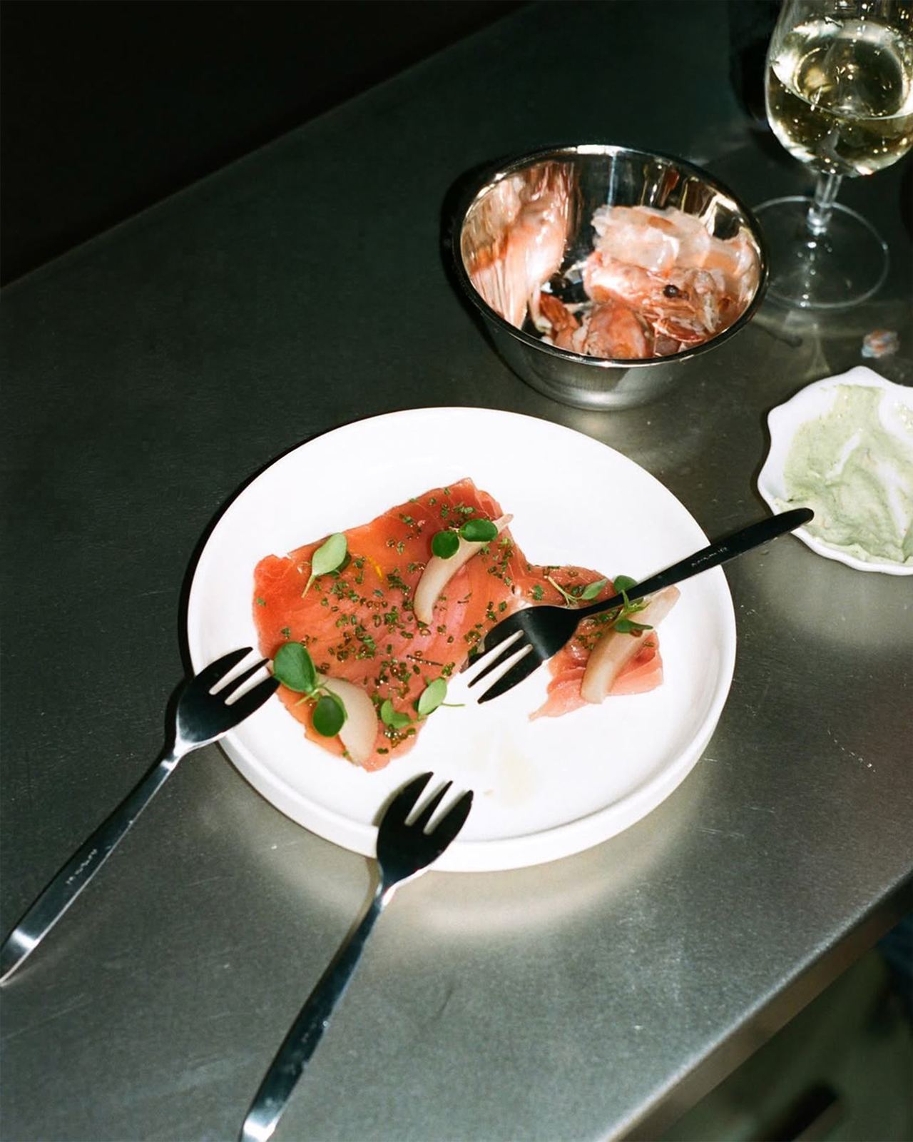 Plate of raw fish with basil